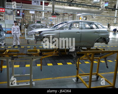 Worker on production line of PSA plant of Chengdu, in China, an automotive factory Stock Photo