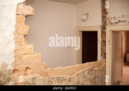 Flat renovation, demolition of the partition wall to create a single larger room Stock Photo