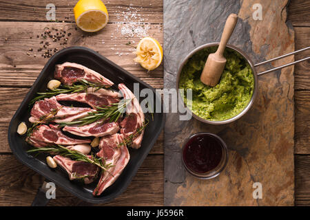 Ribs of lamb and mashed potatoes and peas Stock Photo