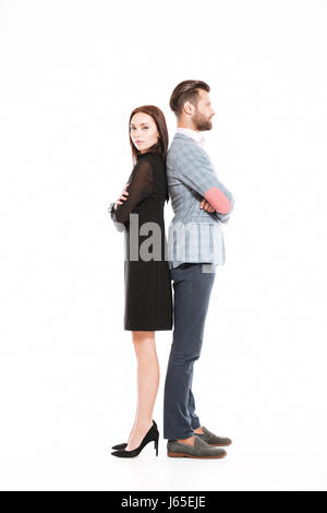 Image of young offended loving couple standing isolated over white background. Stock Photo