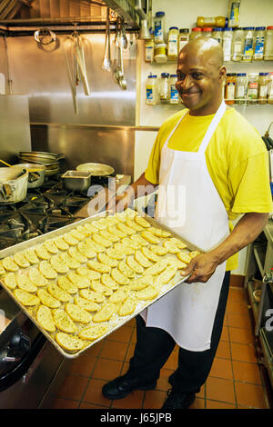 Michigan Saginaw,Montague Inn,bed & breakfast,lodging,historic home,restaurant restaurants food dining cafe cafes,fine dining,kitchen,Black man men ma Stock Photo