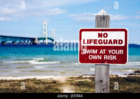 Michigan Mackinaw City,Mackinac historic State Parks Park,Straits of Mackinac,Lake Huron,Old Mackinac Point Lighthouse,Mackinac Bridge,sign,warning,sa Stock Photo