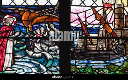 A First World War memorial window, depicting 'safety after the storm of war', by Christopher Whall, St. Peter's Church, Norton on Derwent, Yorkshire. Stock Photo