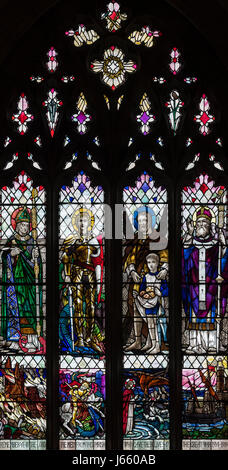 The First World War memorial window by Christopher Whall in St. Peter's Church, Norton on Derwent, North Yorkshire, England Stock Photo