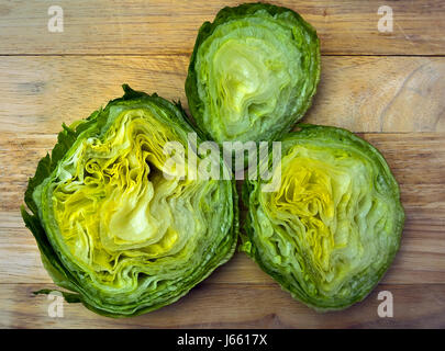 Chopped iceberg-lettuce on wood cutting board Stock Photo