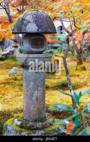 Kasuga doro or stone lantern in Japanese maple garden during autumn at Enkoji temple, Kyoto, Japan Stock Photo