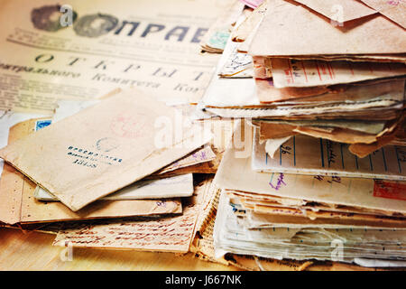 SAINT-PETERSBURG, RUSSIA – MAY 17, 2017: A stack of old postal letters of the 20th century on the newspaper Pravda 1963 Stock Photo