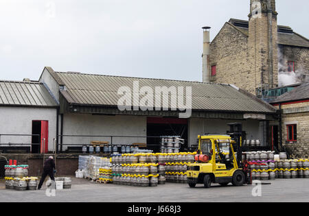 Theakston Brewery with beer kegs in the yard outside. Masham, Wensleydale, North Yorkshire, England, UK, Britain Stock Photo