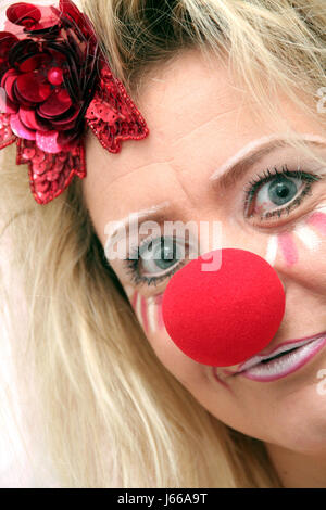 costumed woman with red nose Stock Photo