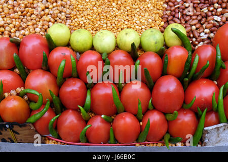 Tomatoes and hot peppers on the market in Delhi, India on February, 13, 2016. Stock Photo