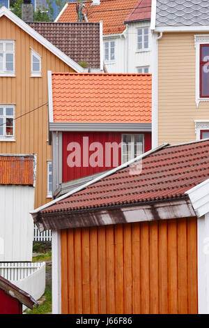 Colored houses facades in Norway. Kristiansund street. Travel background. Vertical Stock Photo