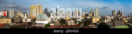 Panorama of Metro Manila juxtaposed with older buildings in Manila City, Luzon Island, Philippines. Stock Photo