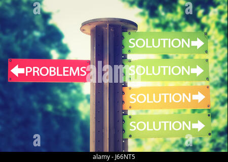Forest park signboard with solution and problems arrows pointing in different directions. Stock Photo