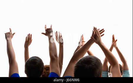 The hands of fans during a concert. Studio shot on white background Stock Photo