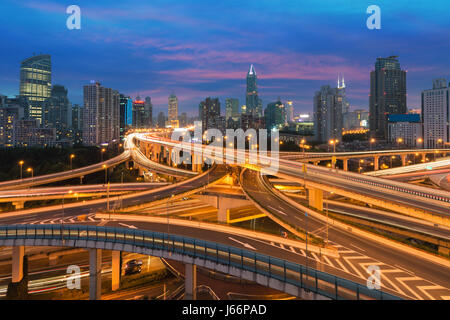 Beautiful Shanghai city with interchange overpass at nightfall in Shanghai, China. Stock Photo