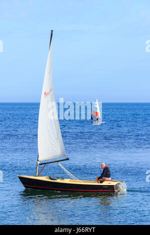 Two sailing dinghies on a calm blue sea at Ringstead Bay, Dorset, UK Stock Photo