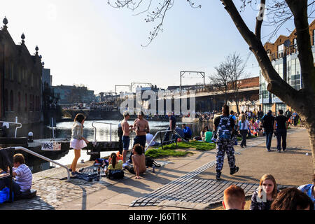 People strolling, meeting and socialising by Regent's Canal at Camden Lock, London, UK Stock Photo