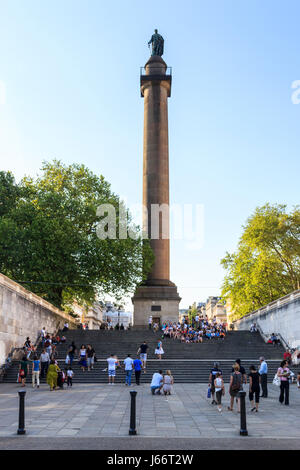 Sightseers and tourists on the steps of Duke of York Column, St. James's, London, UK Stock Photo