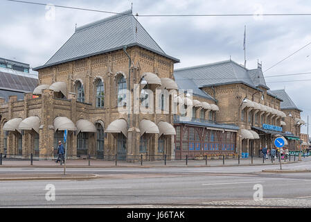 GOTHENBURG, SWEDEN - MAY 13, 2017: Commuters crossing the road on their way to or from the central train station in the Swedish city of Gothenburg. Stock Photo