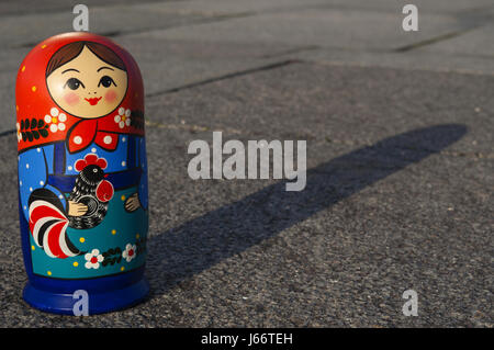 A matryoshka doll, known as Russian nesting doll, a set of wooden dolls of decreasing size placed one inside another Stock Photo