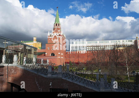 Moscow Kremlin Wall with Troitskaya Tower (Trinity Tower) and the Troitsky Bridge overlooking the Alexander Garden Stock Photo