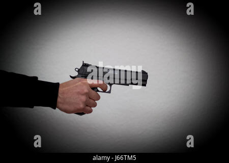 A man holding a pistol and threatened to shoot, criminal, robbery, kidnapping Stock Photo