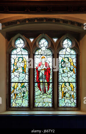 Stained glass window in the church of the abandoned village of Tyneham in Dorset, UK Stock Photo