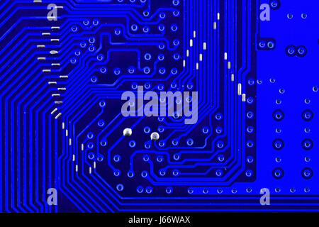 Electronic circuit board as an abstract background pattern. Macro close-up toned. Stock Photo