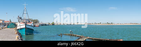 LAAIPLEK, SOUTH AFRICA - APRIL 1, 2017: Panorama of fishing ships and a sunken boat in the harbor at the mouth of the Berg River at Laaiplek on the At Stock Photo