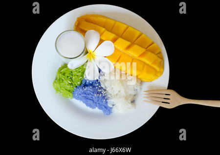 dessert sweet sticky rice with mango coconut milk isolated on black background Stock Photo