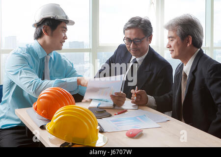team of young and senior engineering man project meeting in working office for project discussion Stock Photo