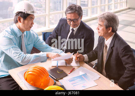 engineering man and senior architecture team project meeting in working office Stock Photo