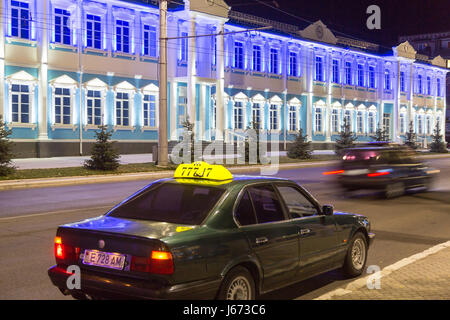 24.08.2016, Moldova, Transnistria, Tiraspol - Taxi on the central main street of the 25th October. Other street: the medical center. Transnistria is a repulsive Moldovan republic under Russian influence east of the river Dnister. The region split from Moldova in 1992 and is not recognized by any other country. Even the Russian-dependent entity is known as the Transdnestrovian Moldavian Republic (Pridnestrovkaja Moldavskaja Respublika / PMR). Tiraspol is the capital. 00A160824D416CAROEX.JPG - NOT for SALE in G E R M A N Y, A U S T R I A, S W I T Z E R L A N D [MODEL RELEASE: NOT APPLICABLE, PRO Stock Photo