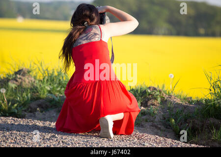 Female photographer taking summer pictures Stock Photo