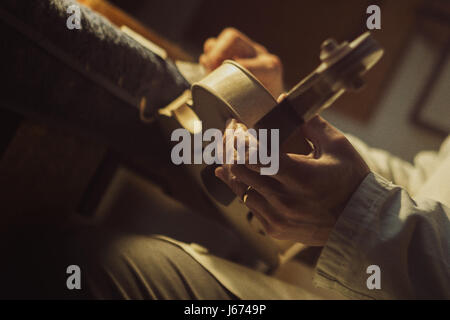 Violin maker at work Stock Photo