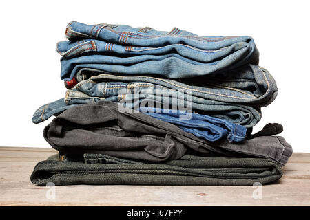 stack of blue jeans on white background Stock Photo