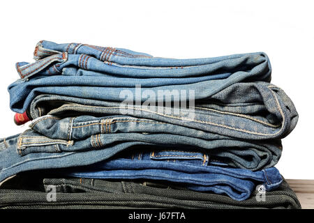 stack of blue jeans on white background Stock Photo