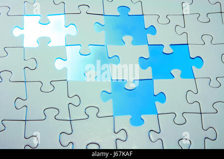 Teamwork symbolized by jigsaw-puzzle Stock Photo