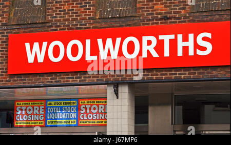 High street shop Woolworths , with store closing down and stock  liquidation sale sign in their  window prior to them stopping trading in 2009 Stock Photo