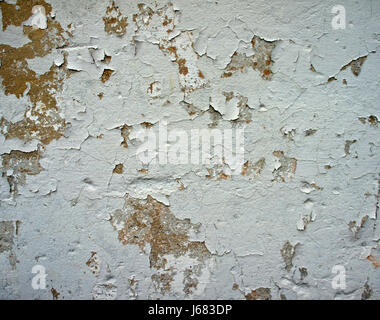 Weather-beaten wall, peeling plaster, paint Stock Photo