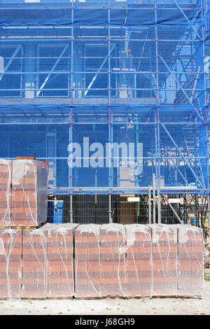 pallets of bricks at construction site Stock Photo