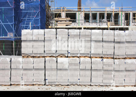 pallets of bricks at construction site Stock Photo