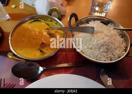 Chicken tika masala with white rice in One Step Up restaurant in Kolkata, West Bengal, India Stock Photo