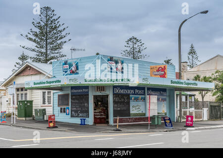 Napier, New Zealand - March 9, 2017: Sunshine Superette is a corner store selling groceries, newspapers and basic household products. Light blue paint