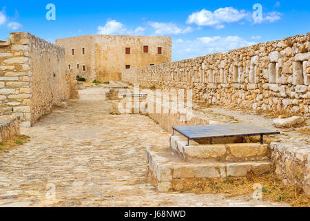 Inner courtyard & fortifications, surrounded by stone walls, Fortezza Castle - Venetian fortress with Bastion defense system on hill Paleokastro in re Stock Photo