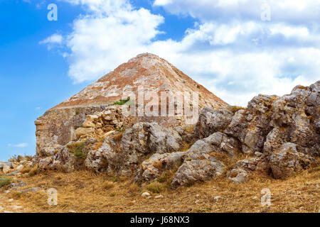 Inner courtyard & fortifications, surrounded by stone walls, Fortezza Castle - Venetian fortress with Bastion defense system on hill Paleokastro in re Stock Photo