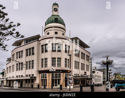 Napier, New Zealand - March 9, 2017: Lone Star office building with clock tower at Emerson and boardwalk intersection. Street scene with heave clouds.