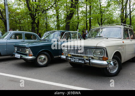 Russia, Moscow. Saturday, May 20, 2017. A show of vintage cars and motor cycles is under way in Sokolniki amusement park. About 200 cars and bikes are exposed in the open air, including many Soviet made cars and automobiles from Sweden, Germany, USA, Japan and other countries of the world. A lot of people visit the exhibition despite the outcast day. Soviet era Moskvich (Muscovite) car by Moscow Moskvich car factory. Popular in 1950-70th. The factory became bankrupt in 2006. Credit: Alex's Pictures/Alamy Live News Stock Photo