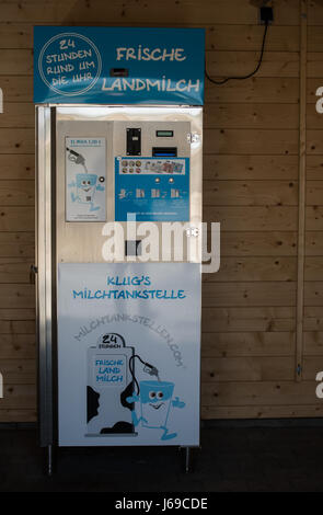 Heuchelheim, Germany. 20th Apr, 2017. A milk vending machine seen in a wooden hut in Heuchelheim, Germany, 20 April 2017. A farmer from the German state of Hesse has invested some 20,000 euros in a milk vending machine and a corresponding parking spot. Customers can now get milk for 1 euro per litre from a tap whenever they feel like it. Photo: Andreas Arnold/dpa/Alamy Live News Stock Photo