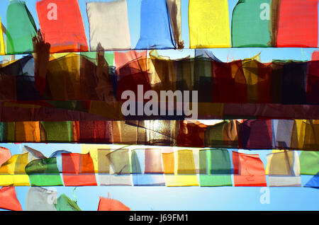 Colorful Buddhism prayer flags Dar Cho, lungta and sun in Svayambunatkh temple. Stock Photo